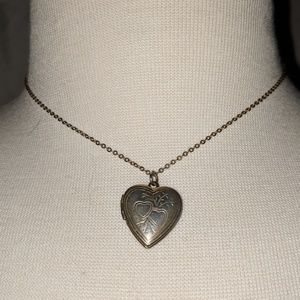 Gold heart locket choker.